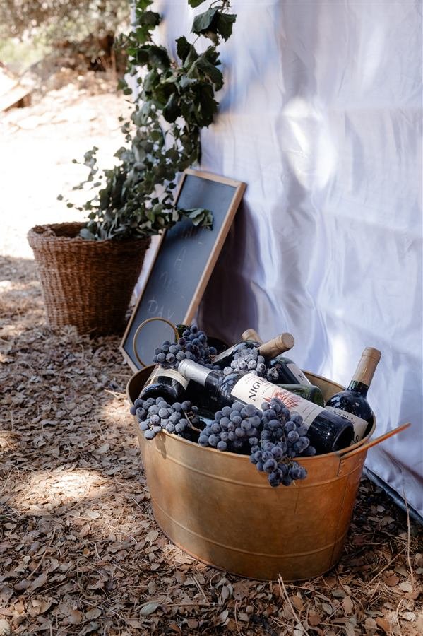Wine from the harvest, chilling in a copper bucket